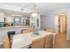 Beach-themed dining area with kitchen access and seating for six at 2100 Ocean Shore Blvd # 203, Ormond Beach, FL 32176