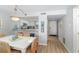 Bright dining area with kitchen access and seating for six at 2100 Ocean Shore Blvd # 203, Ormond Beach, FL 32176
