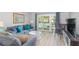 Living room with balcony access and pool view at 2100 Ocean Shore Blvd # 203, Ormond Beach, FL 32176