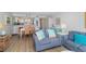 Open concept living and dining area with light floors and coastal decor at 2100 Ocean Shore Blvd # 203, Ormond Beach, FL 32176
