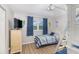 Bright bedroom with full-size bed and built-in bunk beds at 2100 Ocean Shore Blvd # 203, Ormond Beach, FL 32176