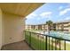 Balcony with view of the community pool and courtyard at 2100 Ocean Shore Blvd # 203, Ormond Beach, FL 32176