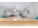 Kitchen view from dining area, showcasing an open floor plan at 2100 Ocean Shore Blvd # 203, Ormond Beach, FL 32176