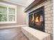 White brick fireplace with black metal screen at 235 Oakdale St, Windermere, FL 34786