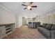 Open concept kitchen with island, gray cabinets, and herringbone floors at 235 Oakdale St, Windermere, FL 34786