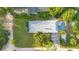 Aerial view showcasing the home, pool, and surrounding landscape at 235 Oakdale St, Windermere, FL 34786