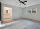 Light and airy bedroom with new carpet and access to bathroom at 235 Oakdale St, Windermere, FL 34786