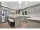 Renovated kitchen featuring an island and herringbone floors at 235 Oakdale St, Windermere, FL 34786