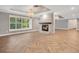 Living room with fireplace and large windows at 235 Oakdale St, Windermere, FL 34786