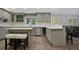 Modern kitchen with gray cabinets, quartz counters, and island at 235 Oakdale St, Windermere, FL 34786