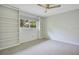 Spacious bedroom featuring built-in shelves and ceiling fan at 235 Oakdale St, Windermere, FL 34786