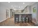 Modern kitchen with gray cabinets, an island, and breakfast bar at 235 Oakdale St, Windermere, FL 34786