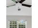 Bright bedroom with window and ceiling fan at 235 Oakdale St, Windermere, FL 34786