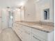 Elegant bathroom with double vanity, granite countertop, and large shower at 235 Oakdale St, Windermere, FL 34786