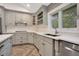 Modern kitchen with gray cabinets, white backsplash and double sink at 235 Oakdale St, Windermere, FL 34786
