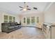 Gathering room with pool view and herringbone floors at 235 Oakdale St, Windermere, FL 34786