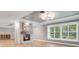 Bright living room with fireplace and herringbone floors at 235 Oakdale St, Windermere, FL 34786