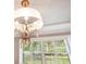Close-up of a beautiful chandelier in the dining room at 235 Oakdale St, Windermere, FL 34786