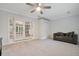 Bright bedroom with ceiling fan and French doors at 235 Oakdale St, Windermere, FL 34786