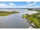 Aerial view of lakefront property with dock and boathouse at 235 Oakdale St, Windermere, FL 34786