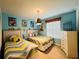Twin bedroom with Minions-themed decor and bright bedding at 710 Gardenia Ln, Davenport, FL 33897