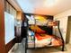 Bunk beds in a vibrant Lion King themed bedroom at 710 Gardenia Ln, Davenport, FL 33897