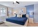 Spacious main bedroom with a king-size bed and neutral color palette at 710 Gardenia Ln, Davenport, FL 33897
