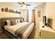 King-size bed in a well-lit bedroom with city skyline wall art at 710 Gardenia Ln, Davenport, FL 33897
