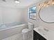 Bathroom features a large soaking tub, toilet and vanity at 702 Sullivan Ave, Ocoee, FL 34761