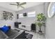 Recreation room with black leather couch and built-in shelving at 424 Pelican Ave, Daytona Beach, FL 32118