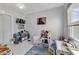 Playroom with colorful rug, toys, and plenty of storage at 424 Pelican Ave, Daytona Beach, FL 32118