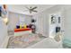 Bedroom with daybed, built-in closet, and access to small office at 424 Pelican Ave, Daytona Beach, FL 32118