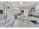 White kitchen with patterned flooring and stainless steel appliances at 424 Pelican Ave, Daytona Beach, FL 32118