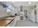 Modern kitchen with white cabinets and wood countertops at 424 Pelican Ave, Daytona Beach, FL 32118