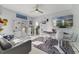 Casual dining area with grey sofa and glass chairs at 424 Pelican Ave, Daytona Beach, FL 32118