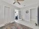 Bedroom with white louvered doors and access to another room at 424 Pelican Ave, Daytona Beach, FL 32118