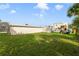 Large backyard with grassy area and partial view of home at 424 Pelican Ave, Daytona Beach, FL 32118