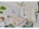 Bedroom with white platform bed, ceiling fan, and light gray walls at 424 Pelican Ave, Daytona Beach, FL 32118