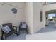 Relaxing front porch with two chairs and decorative pillows at 424 Pelican Ave, Daytona Beach, FL 32118