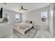 Main bedroom with white shiplap walls and floral bedding at 424 Pelican Ave, Daytona Beach, FL 32118