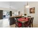Dining area with four chairs and a view into the living room at 105 Pompano Beach Dr, Kissimmee, FL 34746
