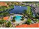 Community pool and clubhouse with lakefront views at 105 Pompano Beach Dr, Kissimmee, FL 34746