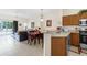 Kitchen with wood cabinets, granite countertops, and stainless steel appliances at 105 Pompano Beach Dr, Kissimmee, FL 34746