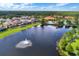 Community pool and lakefront view from above at 105 Pompano Beach Dr, Kissimmee, FL 34746