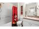 Bathroom with Minnie Mouse themed shower curtain and bathtub at 105 Pompano Beach Dr, Kissimmee, FL 34746