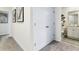 Hallway with linen closet and bathroom access at 1596 Swan Swim Rd, Davenport, FL 33837