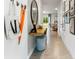 Bright entryway with a console table, mirror, and gallery wall at 1596 Swan Swim Rd, Davenport, FL 33837