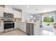 Kitchen with stainless steel appliances and white cabinetry at 1931 Tamarack Pass, Davenport, FL 33837