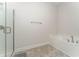 Clean bathroom with a soaking tub and a separate shower at 220 Bergamot Loop, Davenport, FL 33837