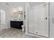Modern bathroom with double vanity, large shower, and tile flooring at 220 Bergamot Loop, Davenport, FL 33837